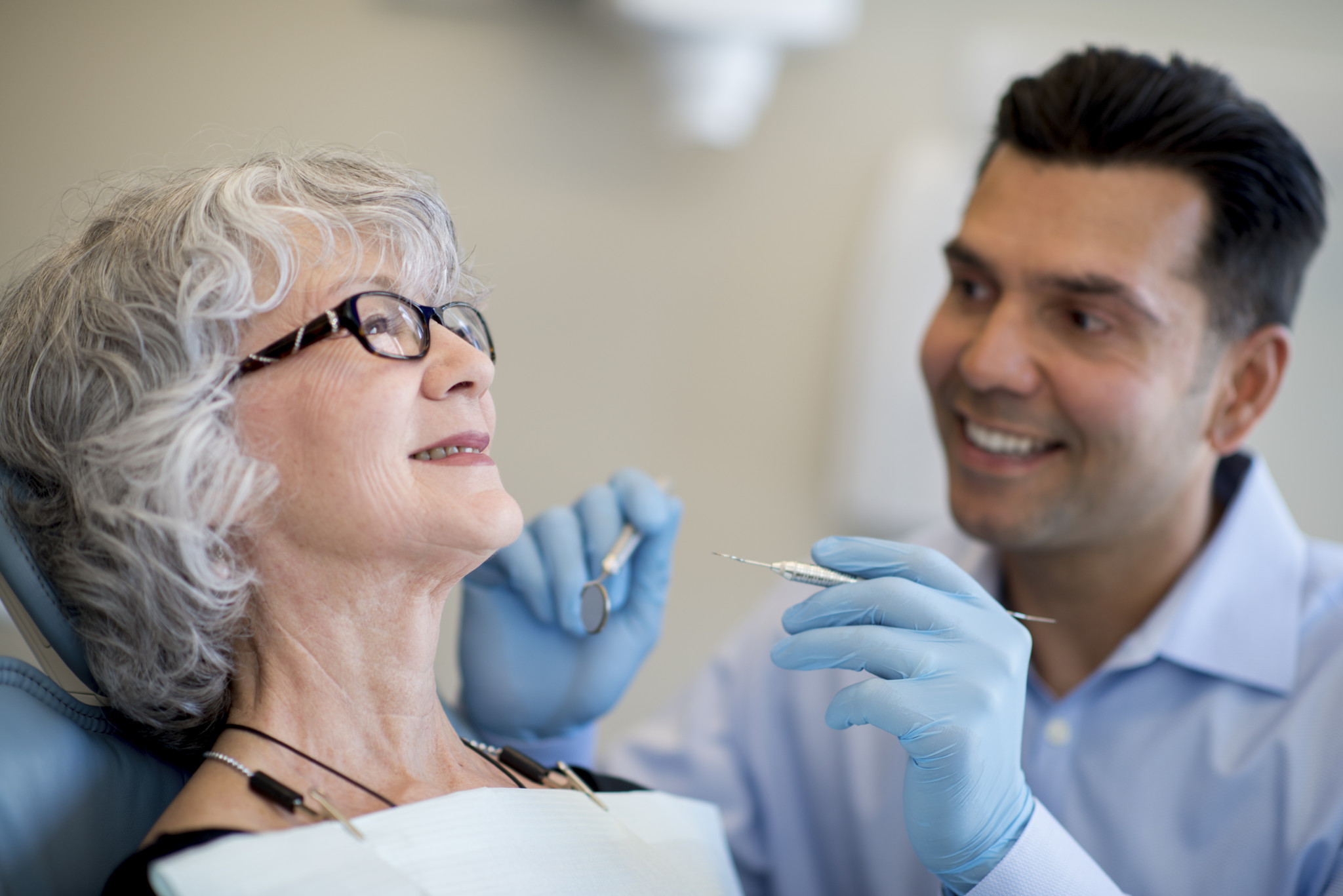 A senior citizen in the dental chair ready for a routine checkup.